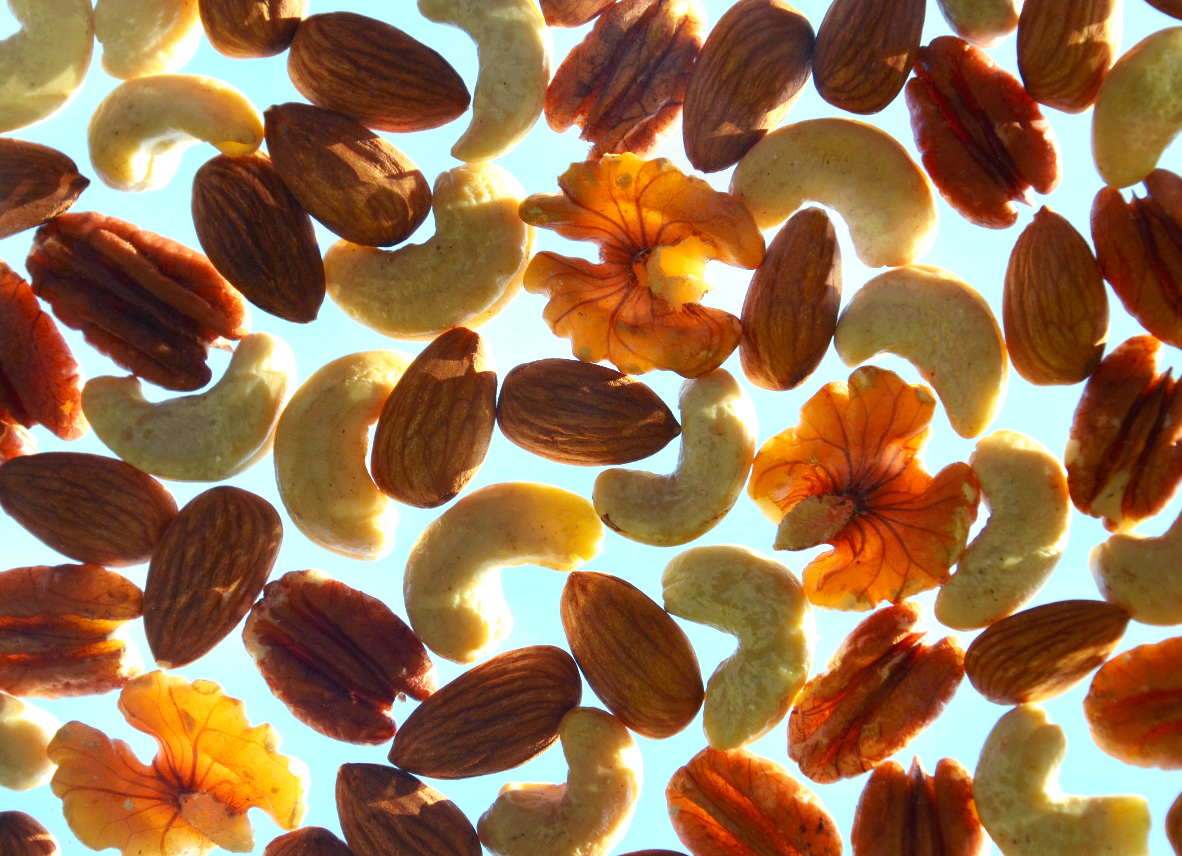 assorted nuts against blue background